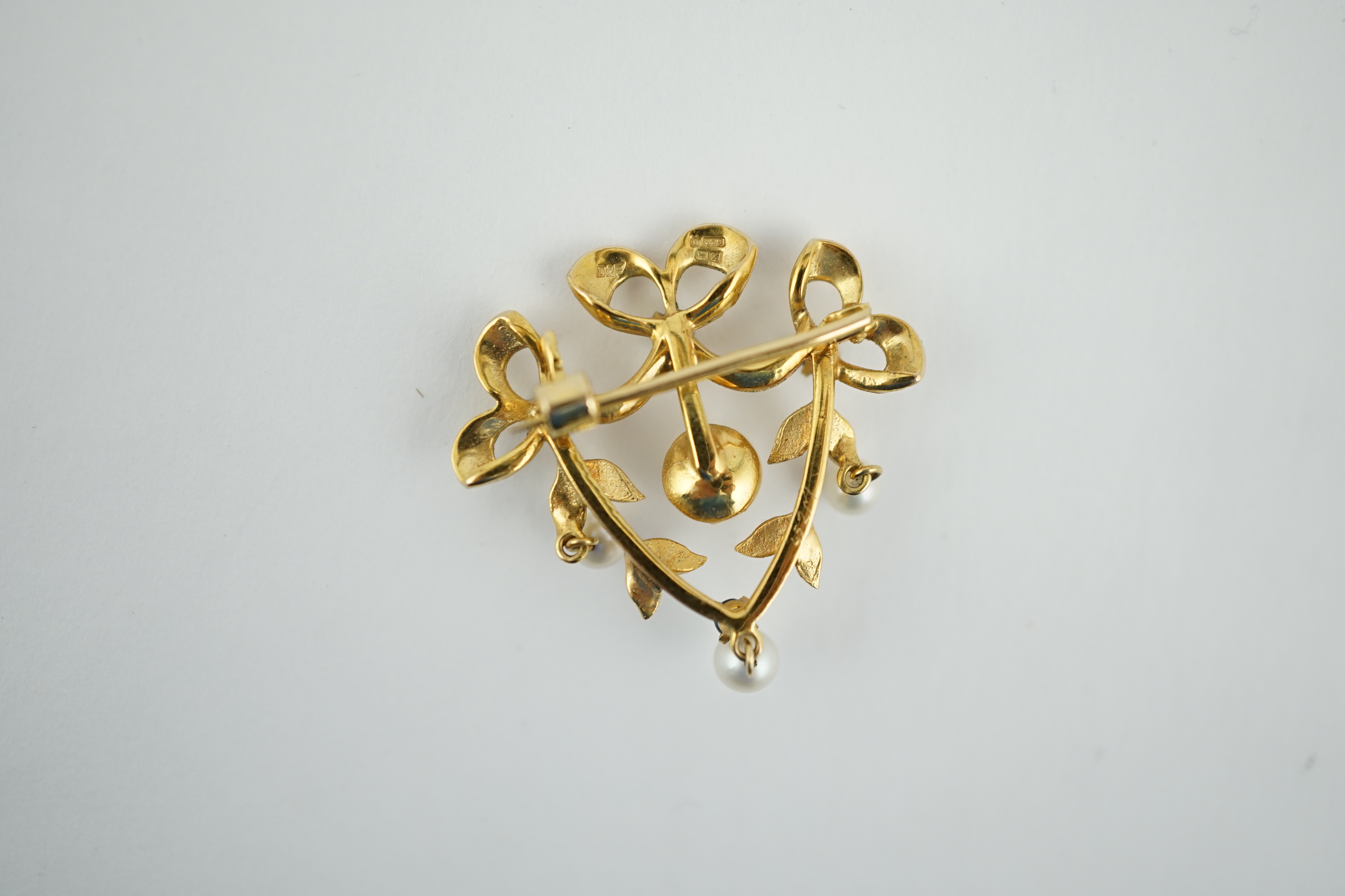 A modern 9ct gold, sapphire and cultured pearl set drop brooch